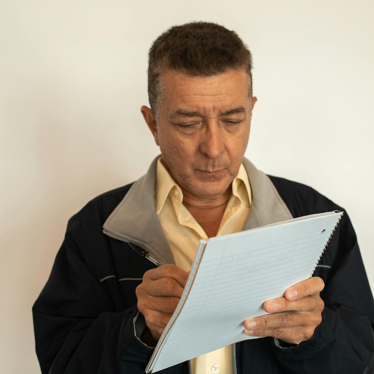 Civilian military employee reviewing pension and health benefit documents before retirement