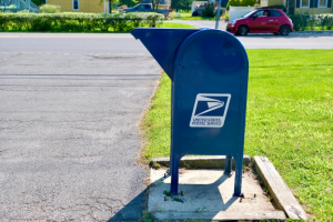 Mailbox symbolizing the transition from FEHB to PSHB for postal service health benefits.